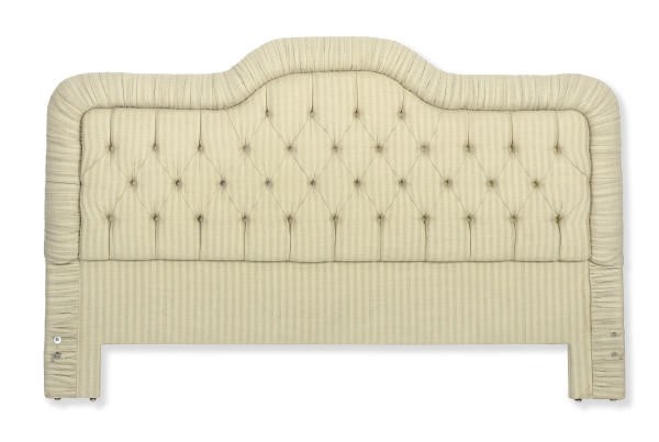 AN UPHOLSTERED HEADBOARD,