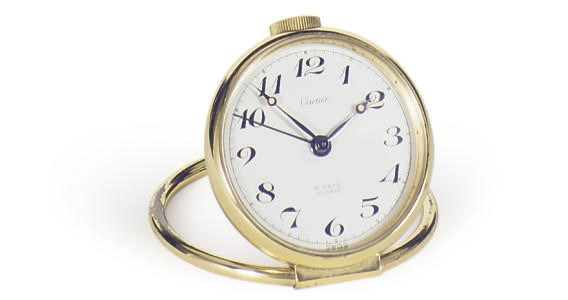 A BRASS DESK CLOCK,