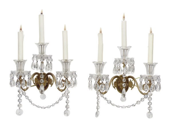 A SET OF SIX ORMOLU AND CUT-GLASS THREE-BRANCH WALL-LIGHTS