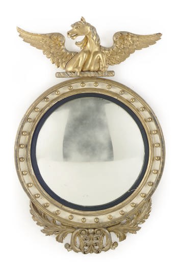 AN ENGLISH CREAM PAINTED AND PARCEL-GILT CONVEX MIRROR,