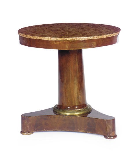 A FRENCH RESTAURATION GILT-METAL MOUNTED MAHOGANY AND MARBLE-TOP CENTER TABLE,