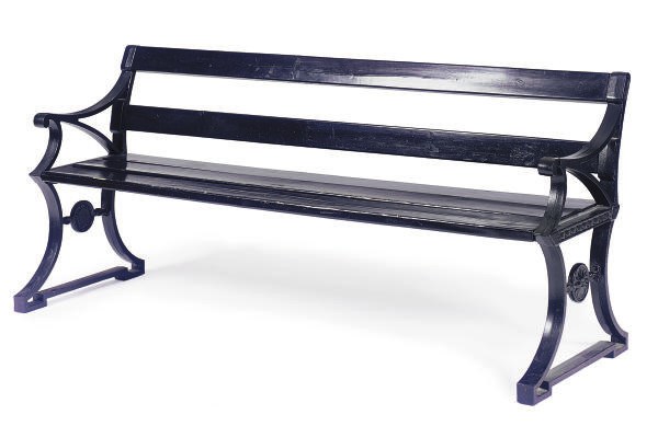 AN EBONIZED IRON AND WOOD BENCH,
