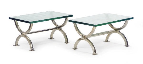 A PAIR OF WHITE-METAL TRESTLE-FORM AND GLASS TOP LOW TABLES,