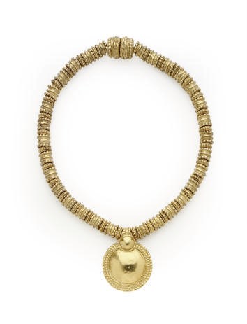 AN YVES SAINT LAURENT HAMMERED GILT-METAL 'ETHNIC' STYLE NECKLACE,