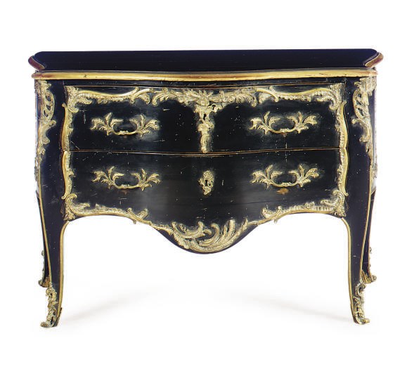 A GILT-METAL MOUNTED EBONIZED AND PARCEL-GILT SERPENTINE BOMBE COMMODE,