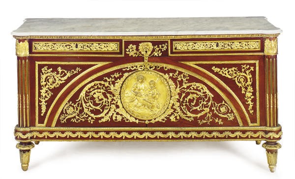 A FRENCH ORMOLU MOUNTED MAHOGANY AND MARBLE-TOP COMMODE,