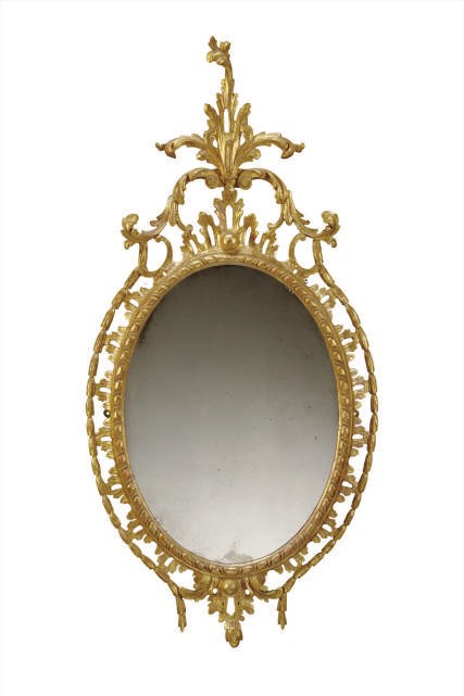 A GILTWOOD OVAL PIER GLASS
