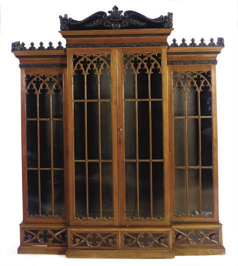 A MAHOGANY AND PART-EBONIZED BREAKFRONT BOOKCASE,