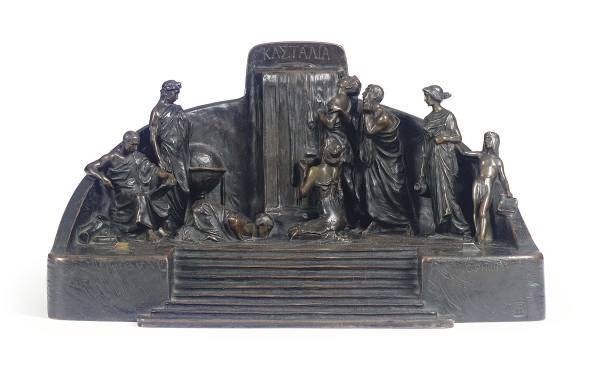 A PATINATED BRONZE FIGURAL INKWELL,