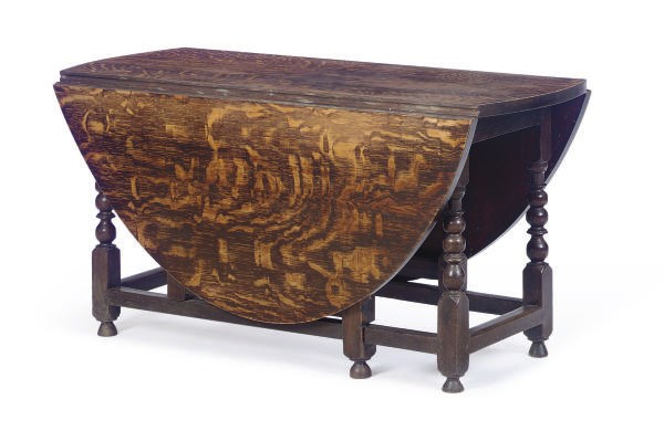 AN ENGLISH OAK AND TIGER GRAIN-PAINTED DROP-LEAF DINING TABLE,
