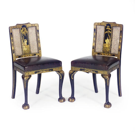 A PAIR OF GILT-JAPANNED AND CANED LEATHER SEAT SIDE CHAIRS,