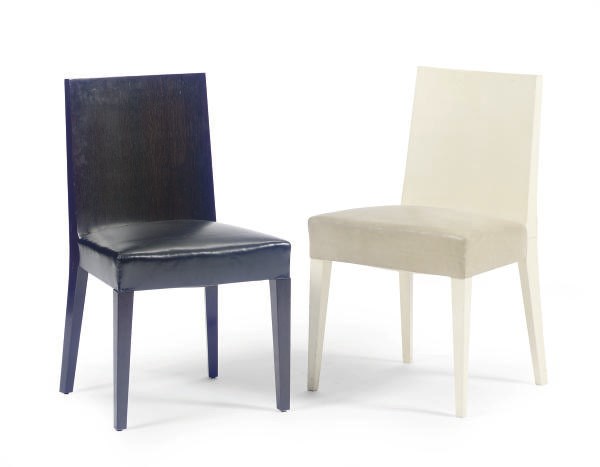 A PAIR OF MACASSAR EBONY AND BLACK LEATHER SIDE CHAIRS TOGETHER WITH A PARCHMENT AND LEATHER EXAMPLE,