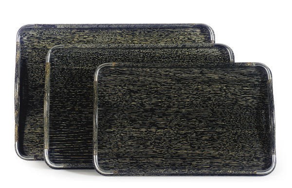 A SET OF THREE CHROMED-METAL MOUNTED STAINED OAK NESTING SERVING TRAYS,