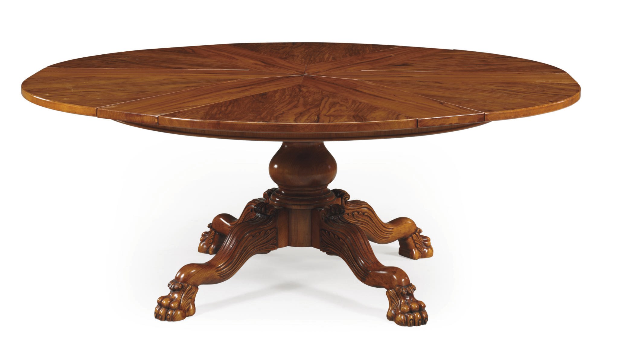 A GRAINED WALNUT EXTENDING CIRCULAR DINING-TABLE