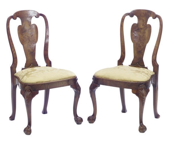 A SET OF TEN WALNUT SIDE CHAIRS,