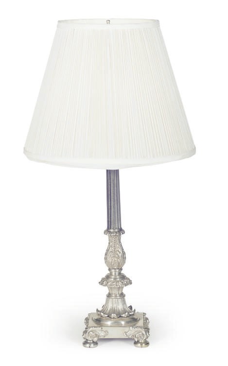 A SILVER-PLATED CANDLESTICK MOUNTED AS A TABLE LAMP,