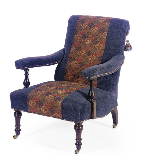 A STAINED MAHOGANY AND UPHOLSTERED LIBRARY ARMCHAIR,