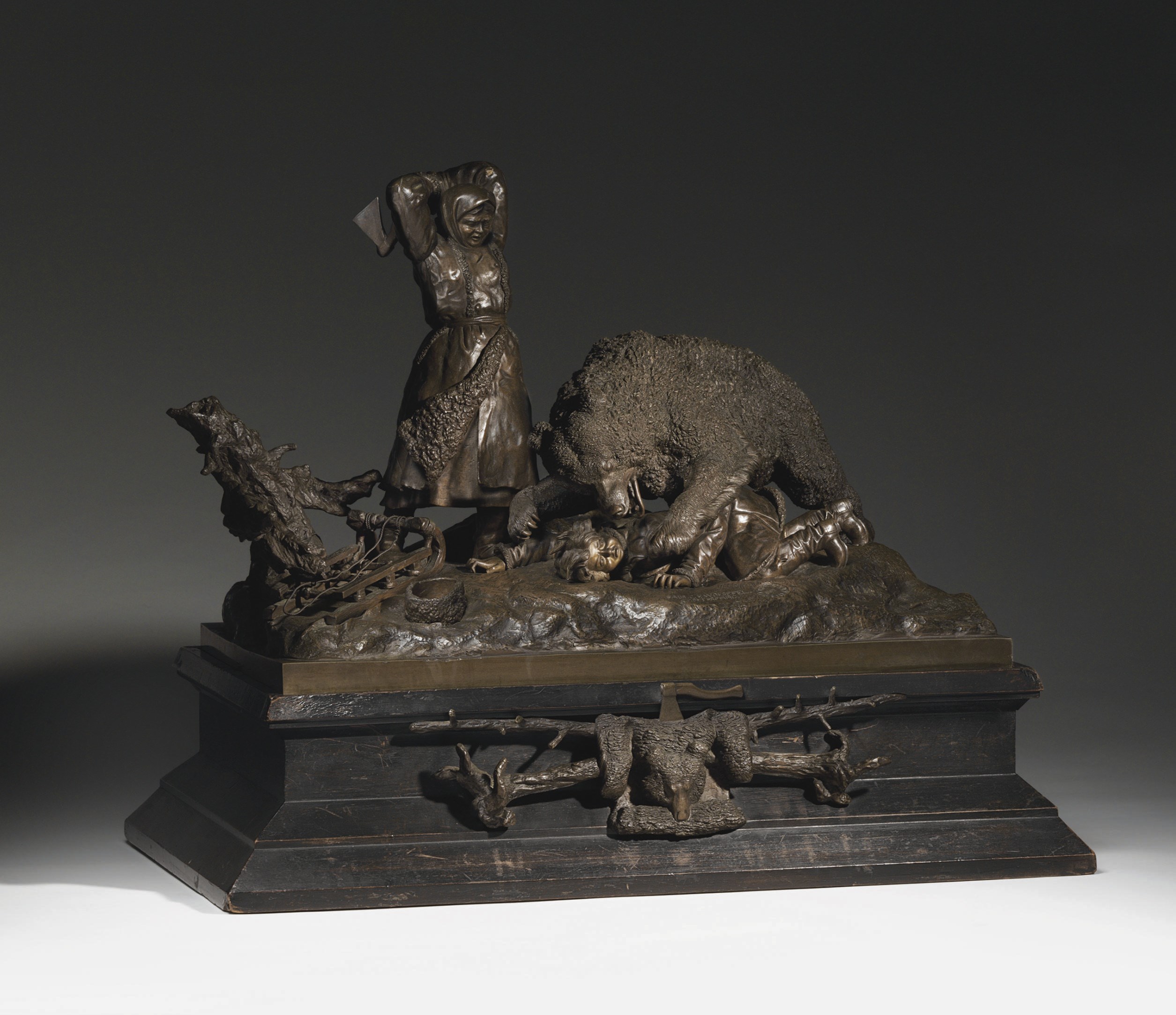 A bronze group of a bear attack