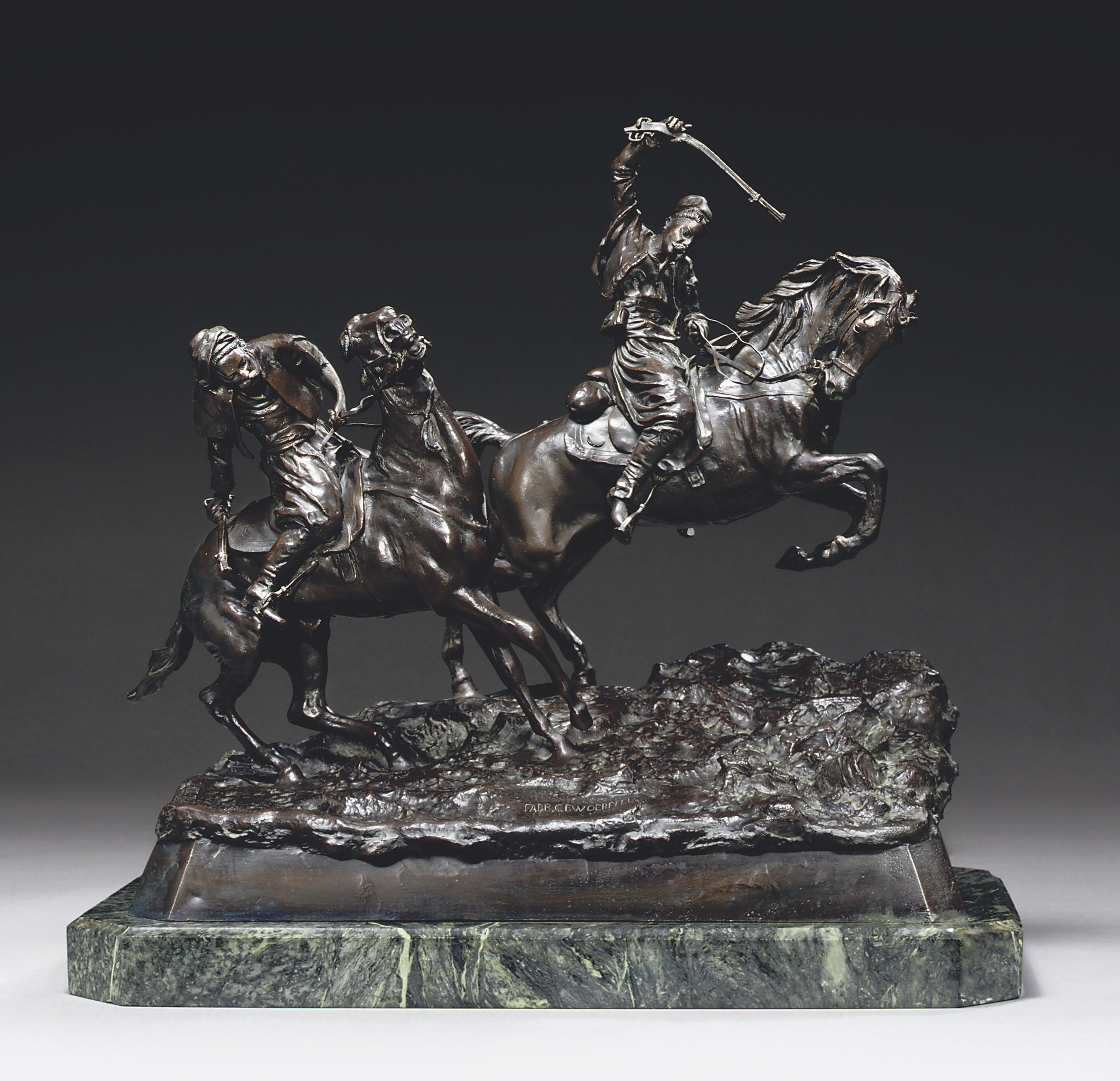 A bronze group of two horsemen