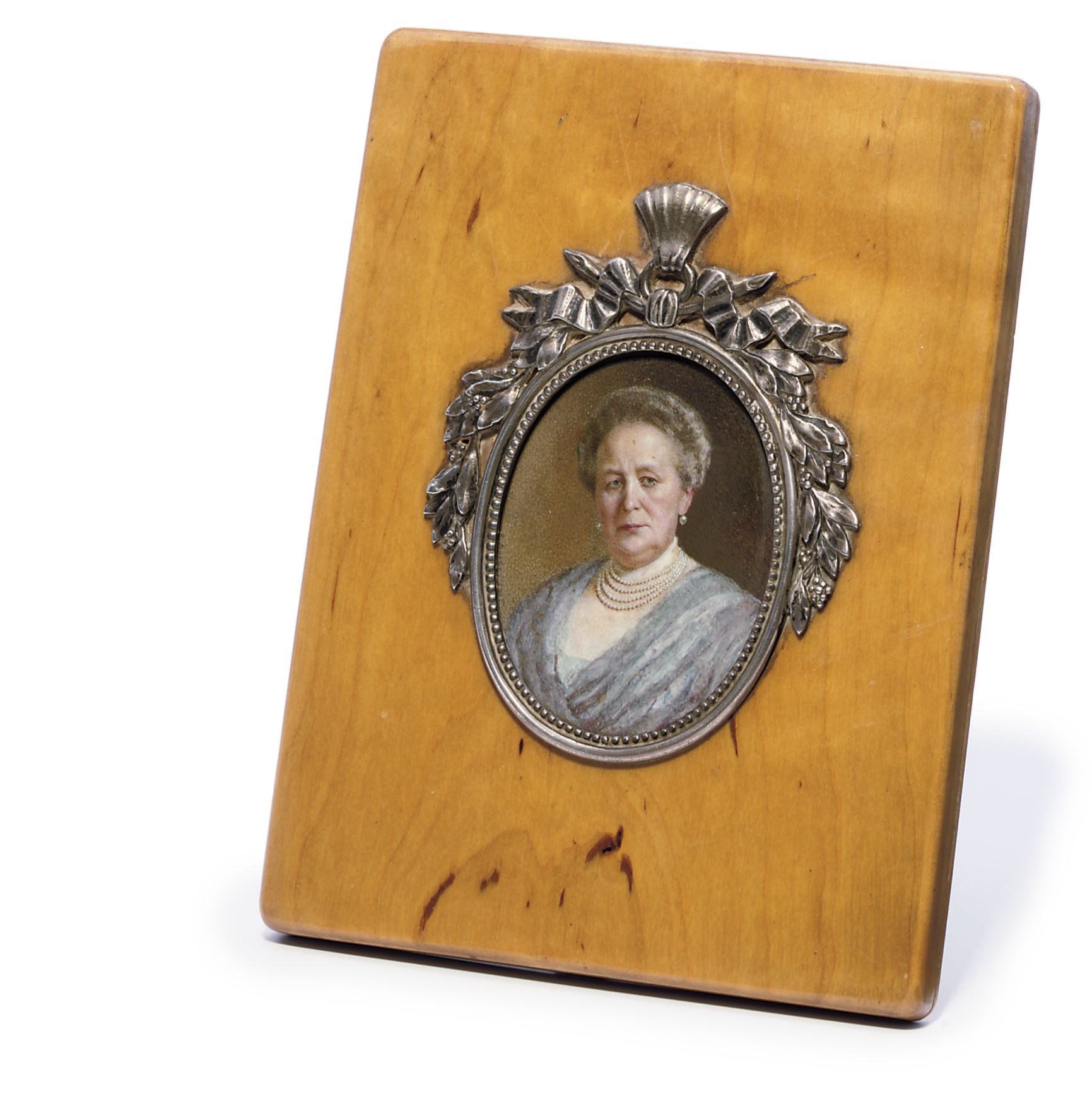 A silver-mounted wooden frame with miniature