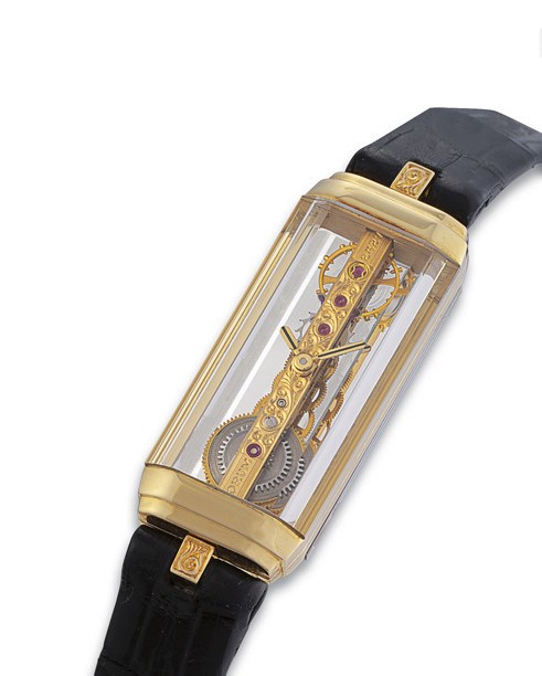 CORUM, "GOLDEN BRIDGE"

LADY'S 18K GOLD MANUAL-WINDING SKELETONISED RECTANGULAR WRISTWATCH