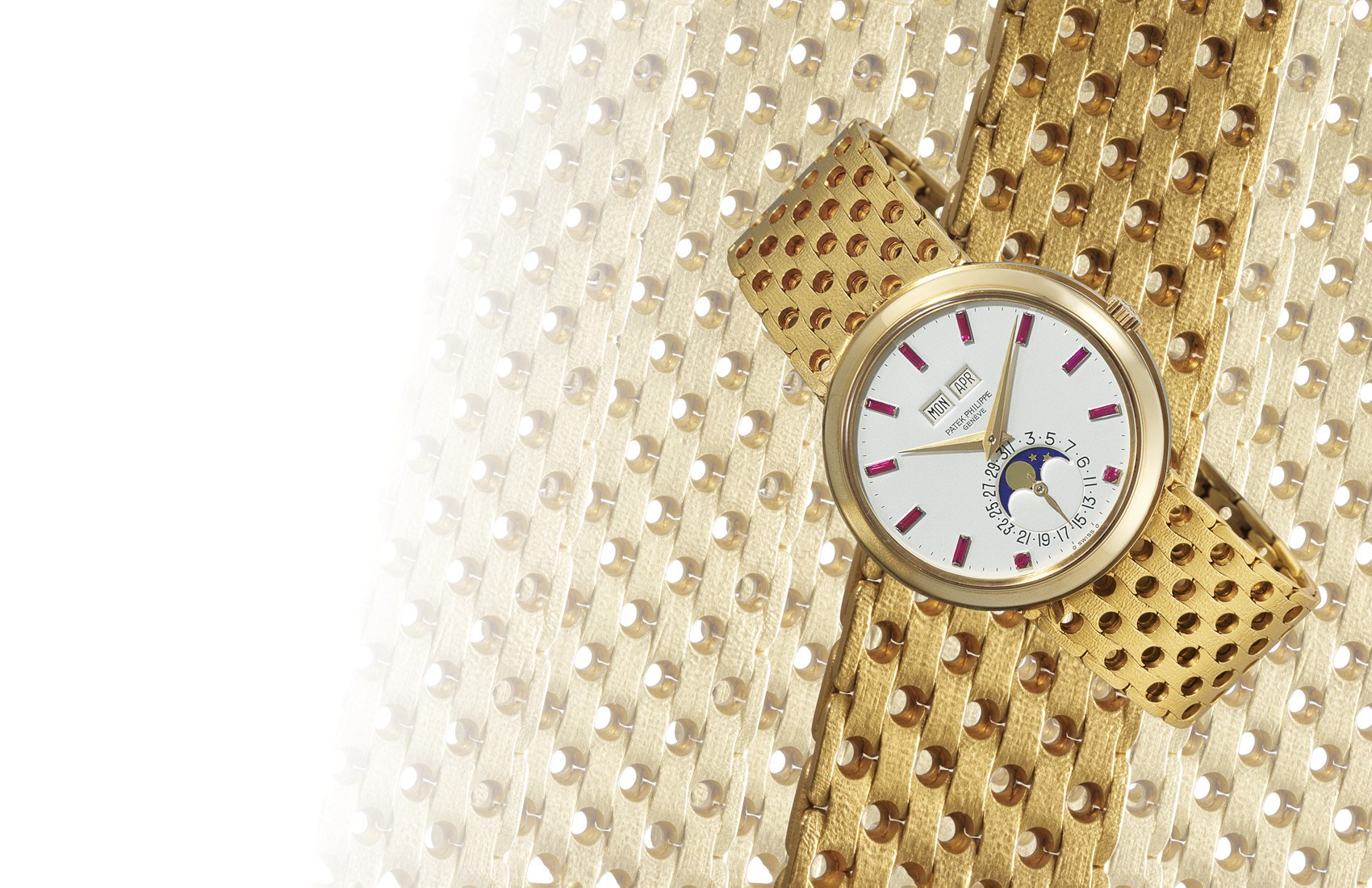 PATEK PHILIPPE, REF. 3448/8

18K GOLD SELF-WINDING PERPETUAL CALENDAR BRACELET WATCH WITH MOON-PHASE DISPLAY AND RUBY-SET HOUR MARKERS