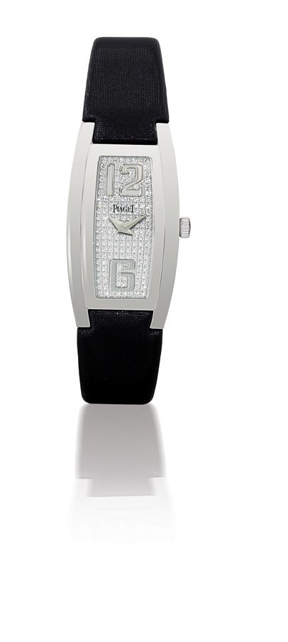 PIAGET, "LIMELIGHT"

LADY'S 18K WHITE GOLD AND DIAMOND-SET TONNEAU-SHAPED WRISTWATCH