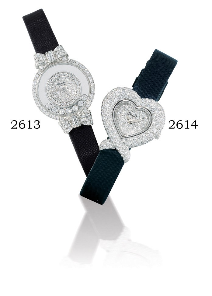 PIAGET, HEART

LADY'S 18K WHITE GOLD AND DIAMOND-SET HEART-SHAPED WRISTWATCH