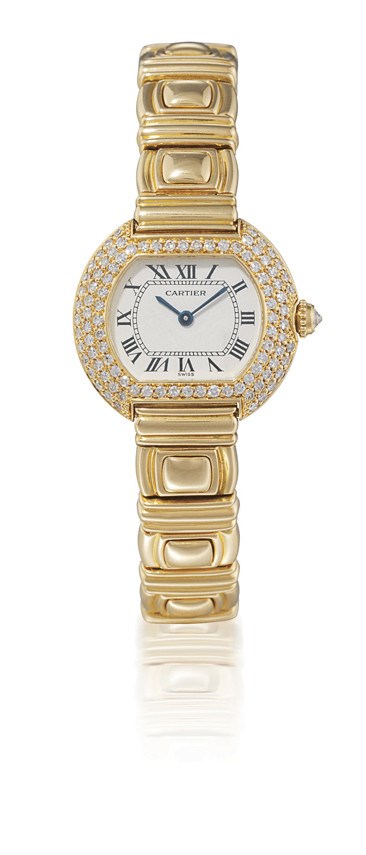 CARTIER, "ELLIPSE"

FINE AND UNUSUAL, LADY'S 18K GOLD AND DIAMOND-SET TONNEAU-SHAPED BRACELET WATCH