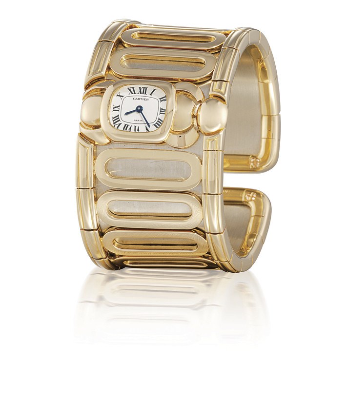 CARTIER

LADY'S 18K GOLD BANGLE WATCH