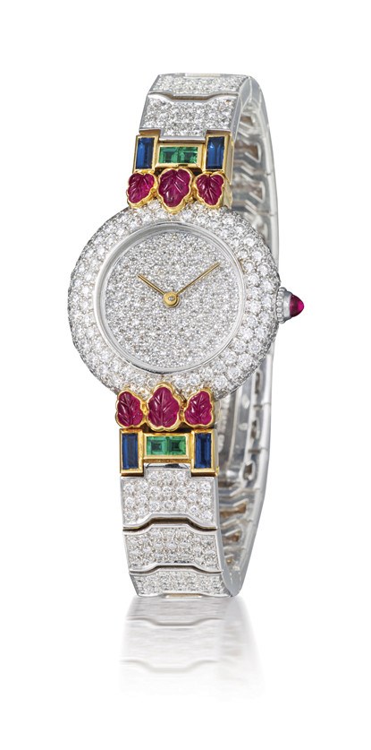 CARTIER

LADY'S 18K WHITE GOLD, DIAMOND, EMERALD, RUBY AND SAPPHIRE-SET BRACLET WATCH