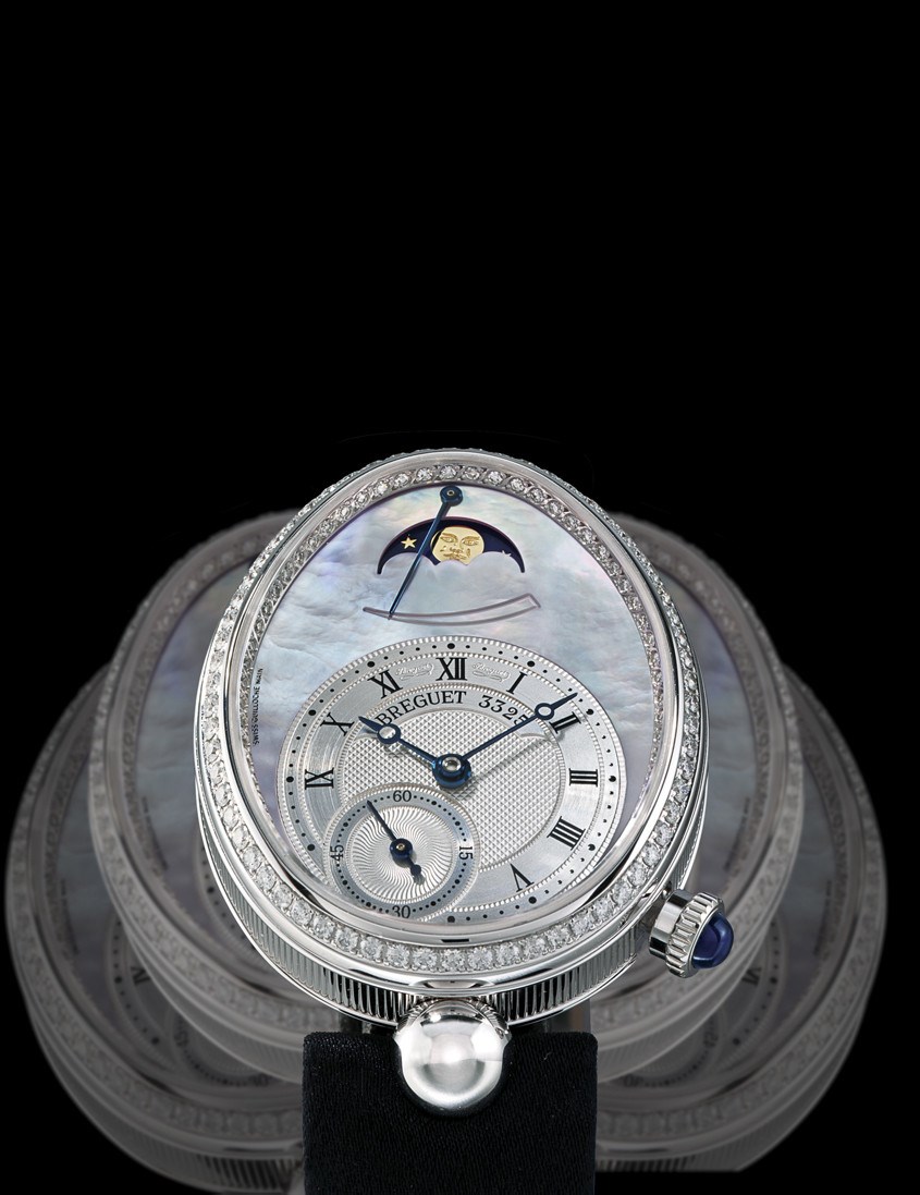 BREGUET, "REINE DE NAPLES"

LADY'S 18K WHITE GOLD AND DIAMOND-SET SELF-WINDING OVOID WRISTWATCH WITH SMALL SECONDS, MOON-PHASES, POWER-RESERVE INDICATION AND MOTHER-OF-PEARL DIAL