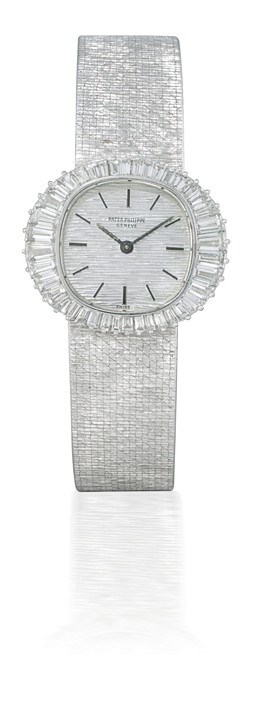 PATEK PHILIPPE, REF. 3393/1

LADY'S 18K WHITE GOLD AND DIAMOND-SET MANUAL-WINDING OVAL-SHAPED BRACELET WATCH