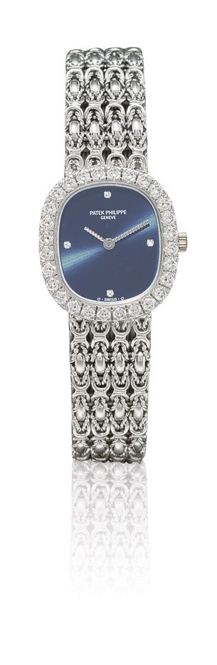 PATEK PHILIPPE, REF. 4734/1G

LADY'S 18K WHITE GOLD AND DIAMOND-SET OVAL BRACELET WATCH