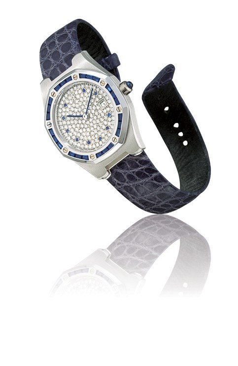 AUDEMARS PIGUET, "ROYAL OAK"

LADY'S 18K WHITE GOLD, DIAMOND AND SAPPHIRE-SET TONNEAU-SHAPED WRISTWATCH WITH DATE