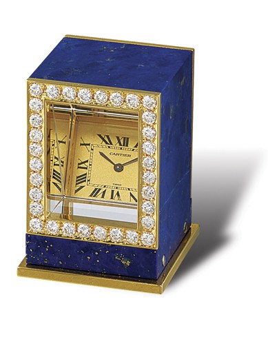 CARTIER, PENDULE MYSTÉRIEUSE PRISME

GOLD, SILVER, DIAMOND-SET AND LAPIS LAZULI RECTANGULAR MINIATURE DESK CLOCK