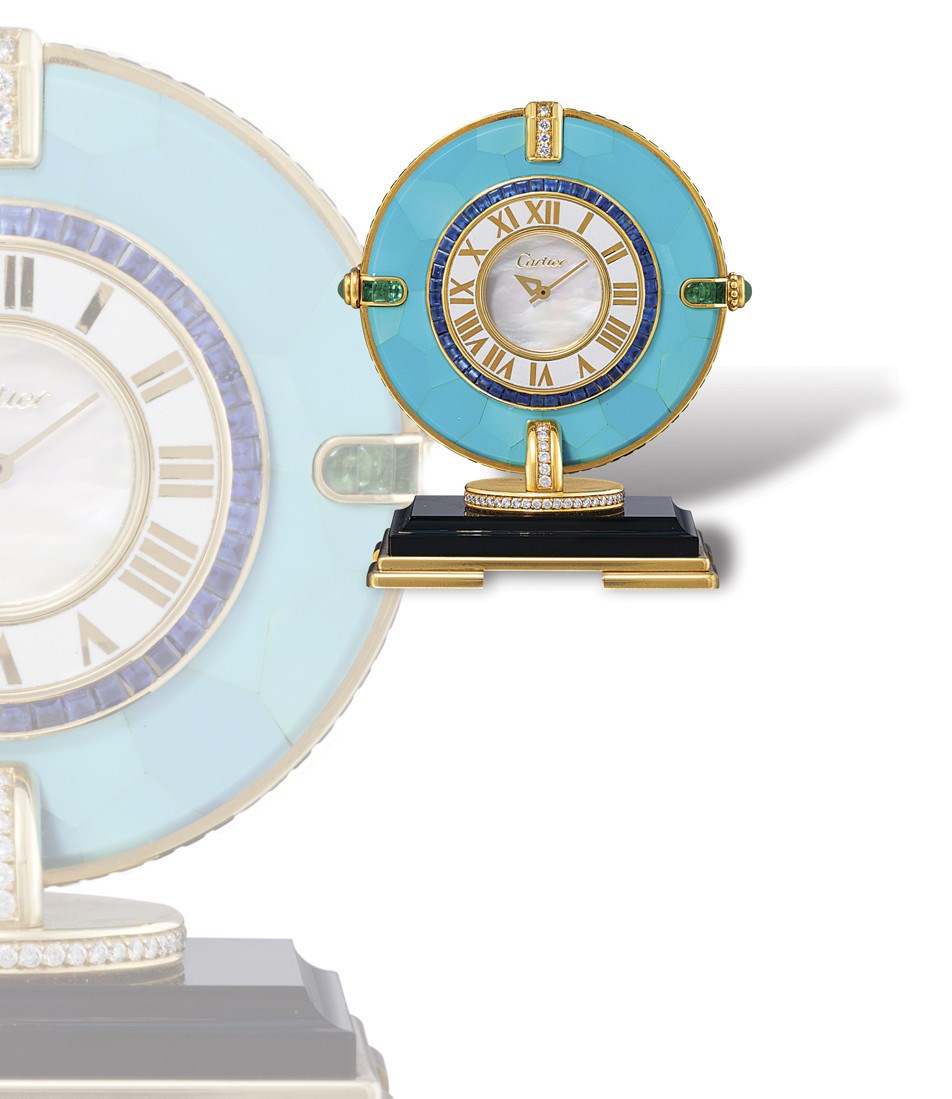 CARTIER, PENDULETTE EN CADRAN

18K GOLD, MULTI-GEMS, ENAMEL, ONYX AND TURQUOISE MINIATURE DESK CLOCK WITH MOTHER-OF-PEARL DIAL