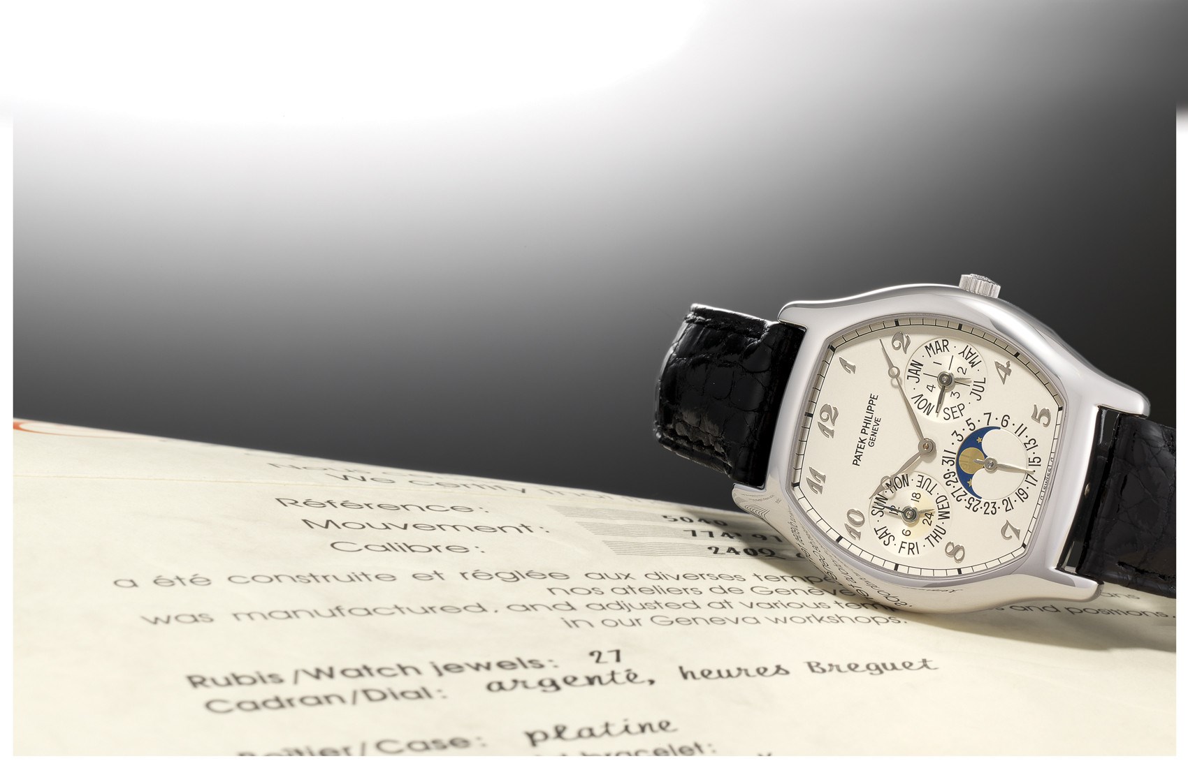 PATEK PHILIPPE, REF. 5040P

950 PLATINUM SELF-WINDING TONNEAU-SHAPED PERPETUAL CALENDAR WRISTWATCH WITH MOON-PHASE DISPLAY