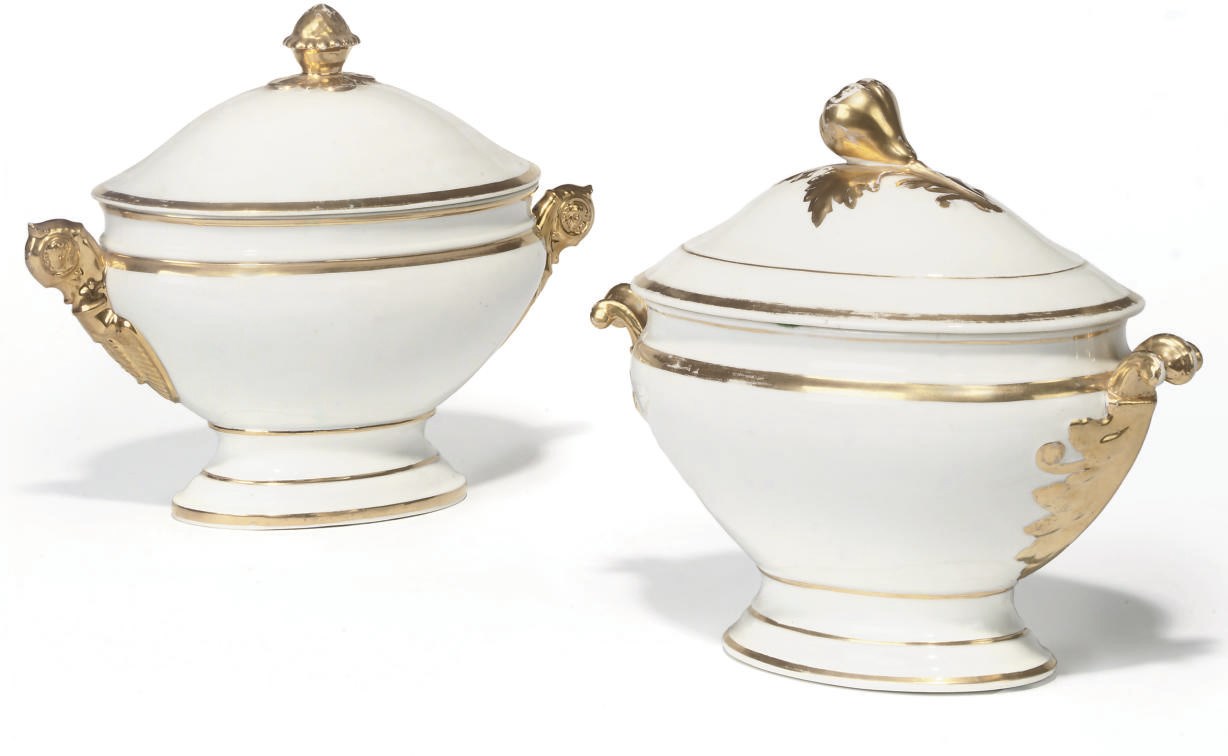 TWO CONTINENTAL PORCELAIN GILT AND WHITE TWO-HANDLED OVAL SAUCE TUREENS AND COVERS