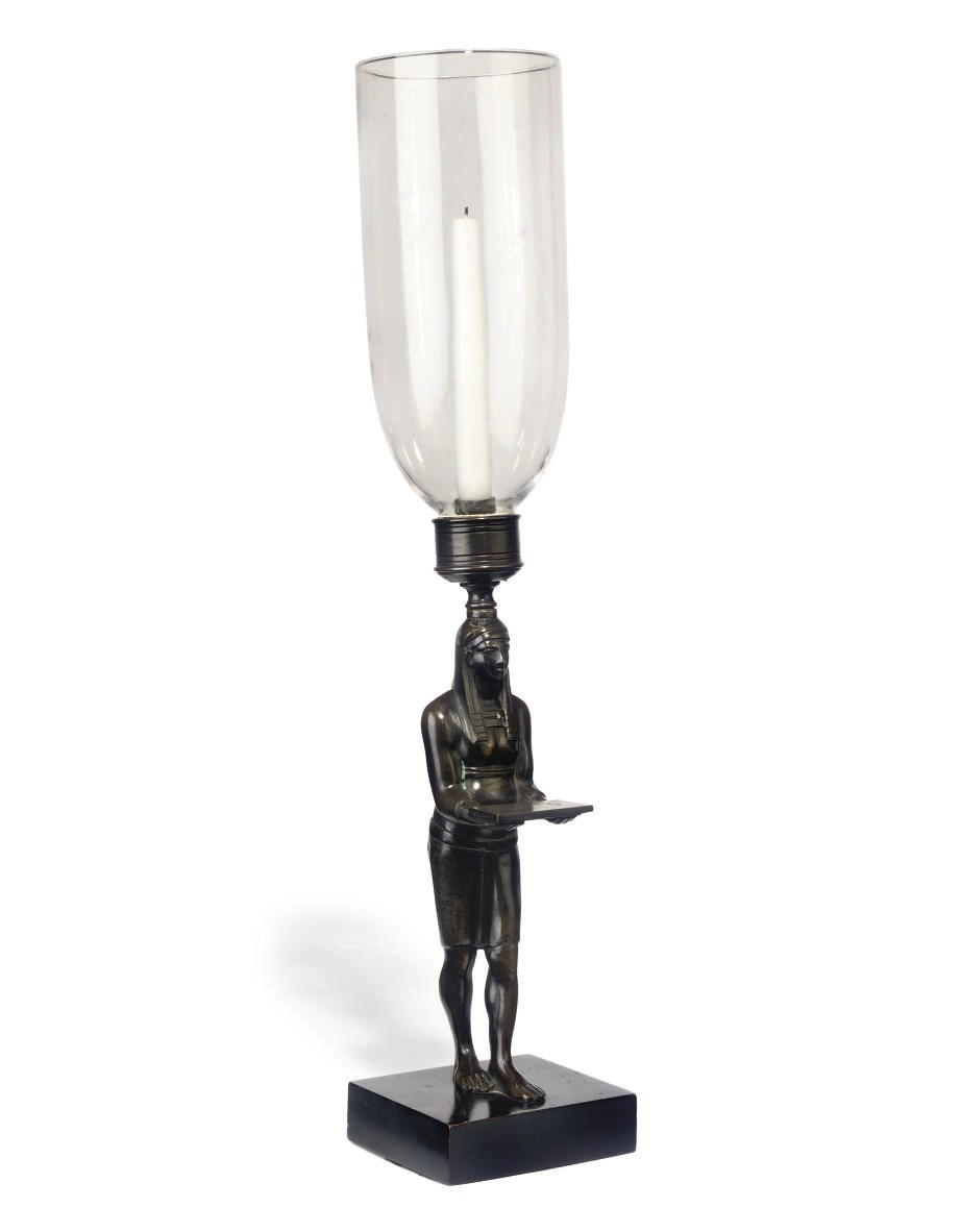 A BRONZE FIGURAL LAMP DEPICTING ANTINUOUS