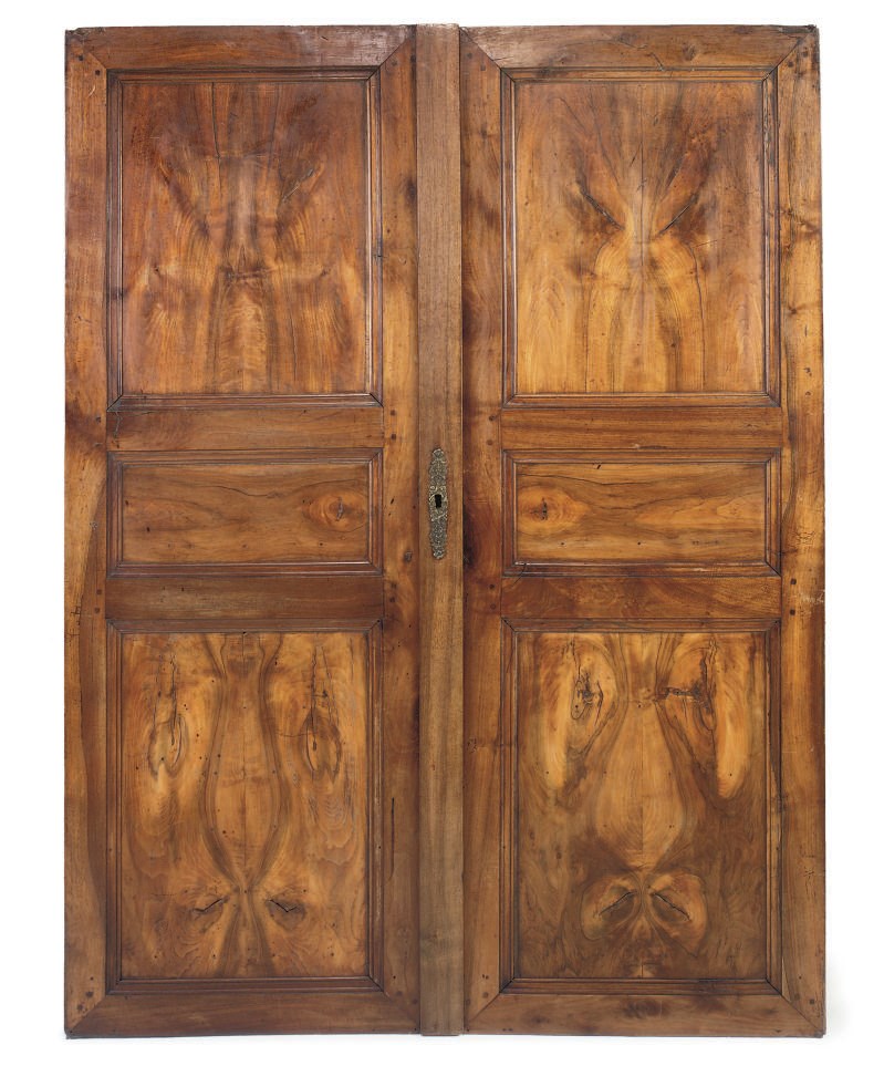 A PAIR OF FRENCH PROVINCIAL WALNUT ARMOIRE DOORS