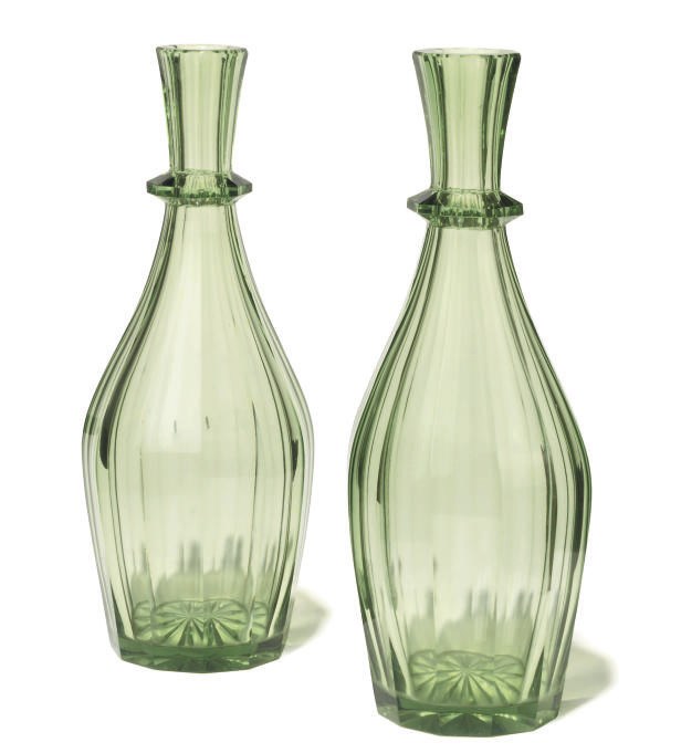 A PAIR OF ENGLISH GREEN GLASS DECANTERS