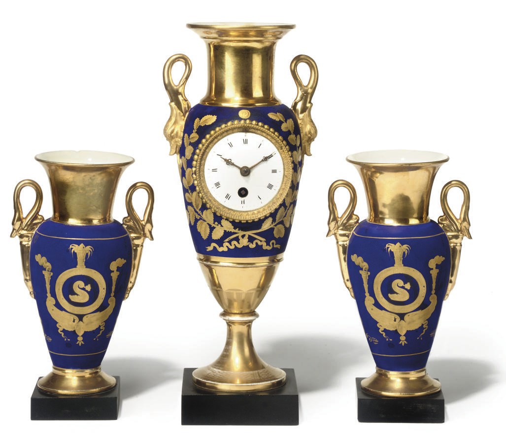 A PARIS MATT-BLUE-GROUND AND PARCEL-GILT PORCELAIN ASSEMBLED TIMEPIECE GARNITURE