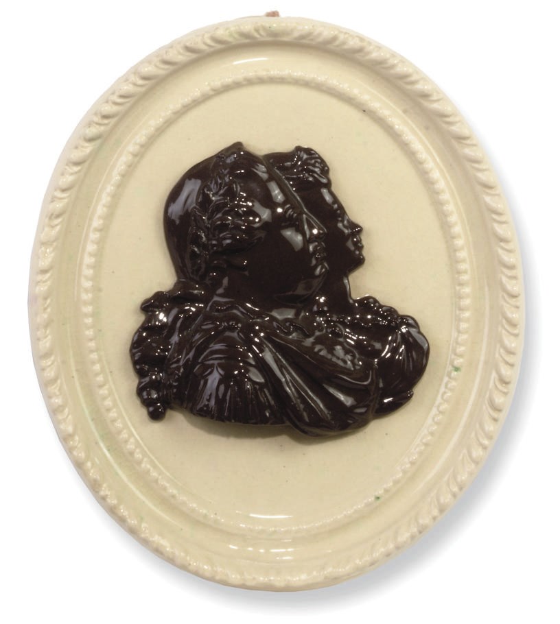 AN ENGLISH POTTERY OVAL PLAQUE