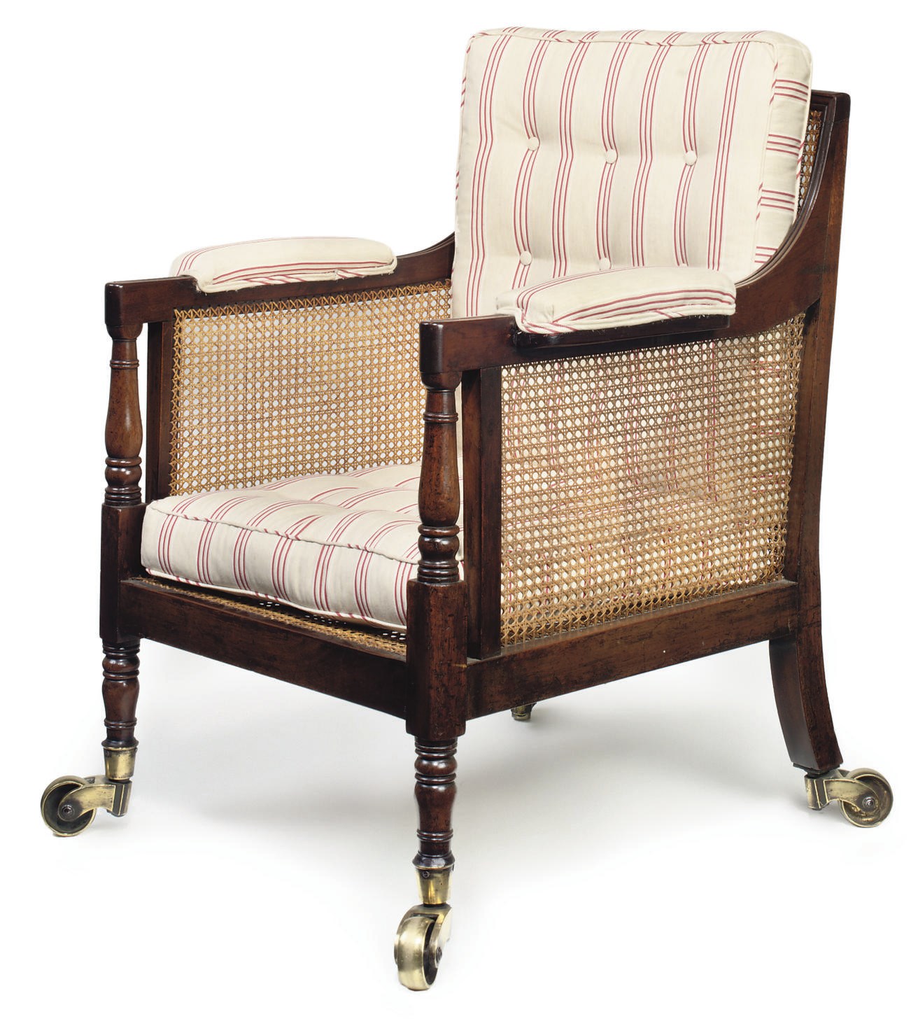 A REGENCY MAHOGANY CANED BERGERE