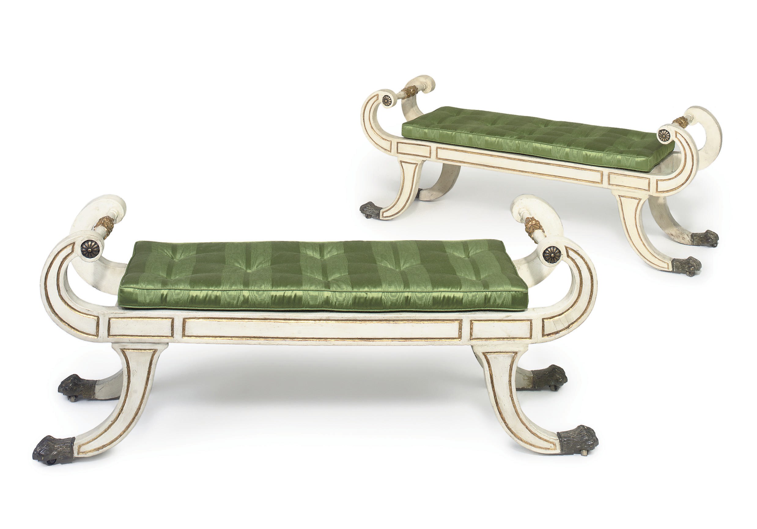 A PAIR OF IRISH REGENCY PARCEL-GILT AND WHITE PAINTED WINDOW SEATS