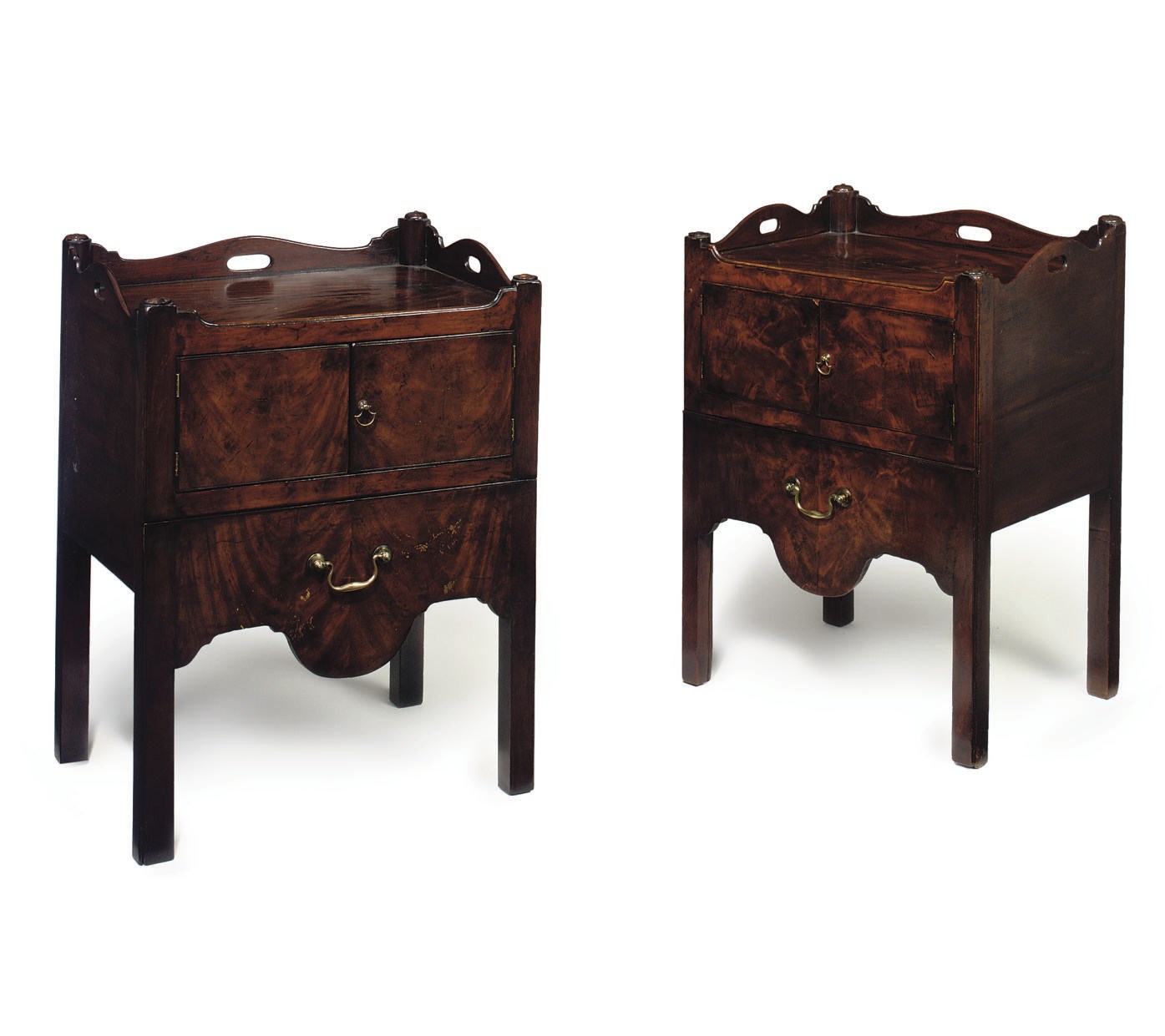 A MATCHED PAIR OF GEORGE III MAHOGANY BEDSIDE CUPBOARDS