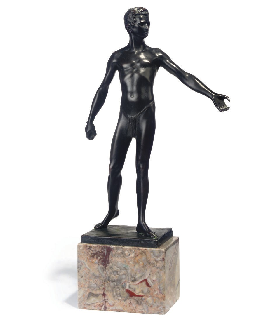 A BRONZE FIGURE OF A SEMI-NAKED WARRIOR