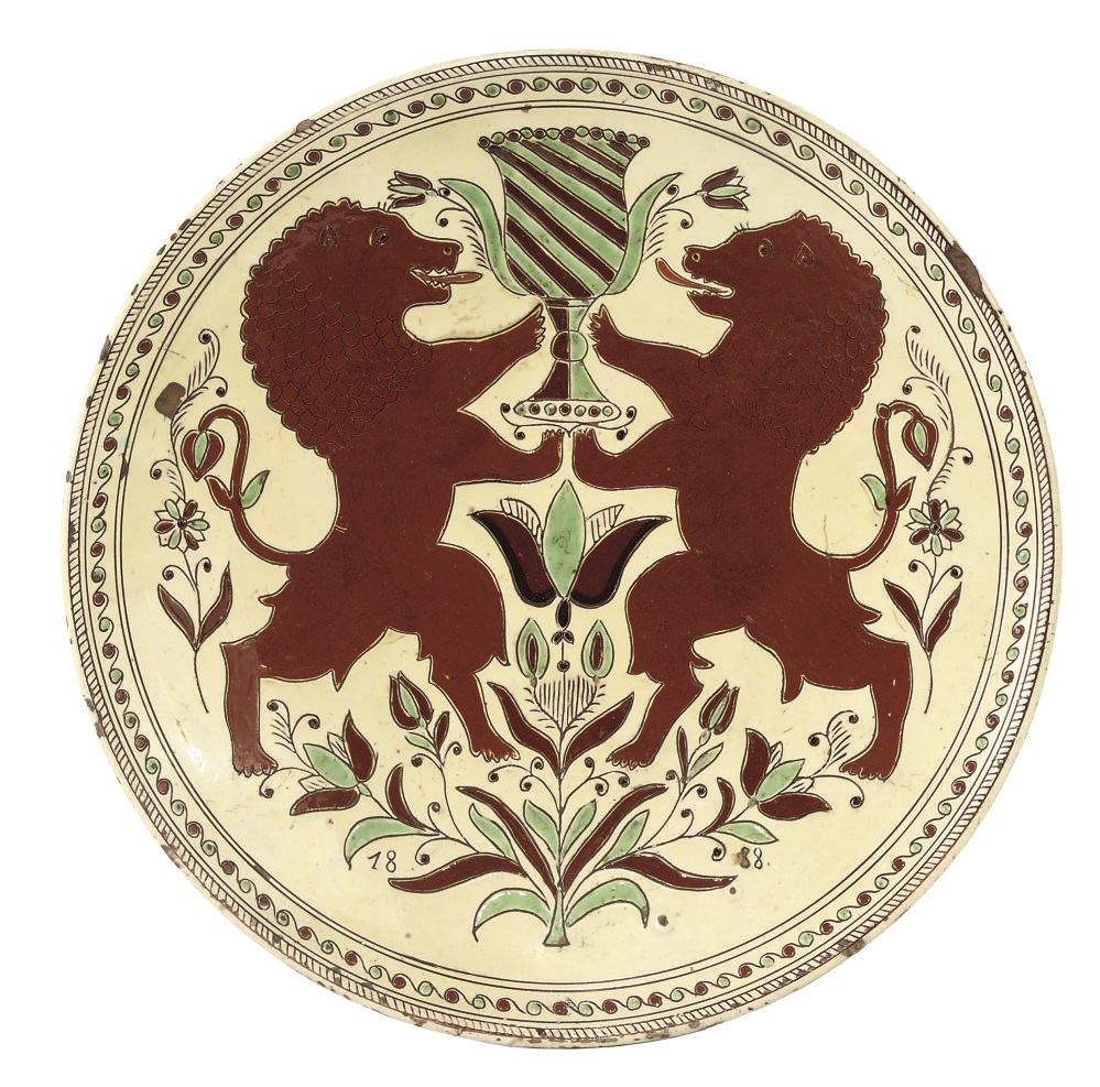 A SWISS (THOUNE) SLIPWARE DECORATED EARTHENWARE CHARGER