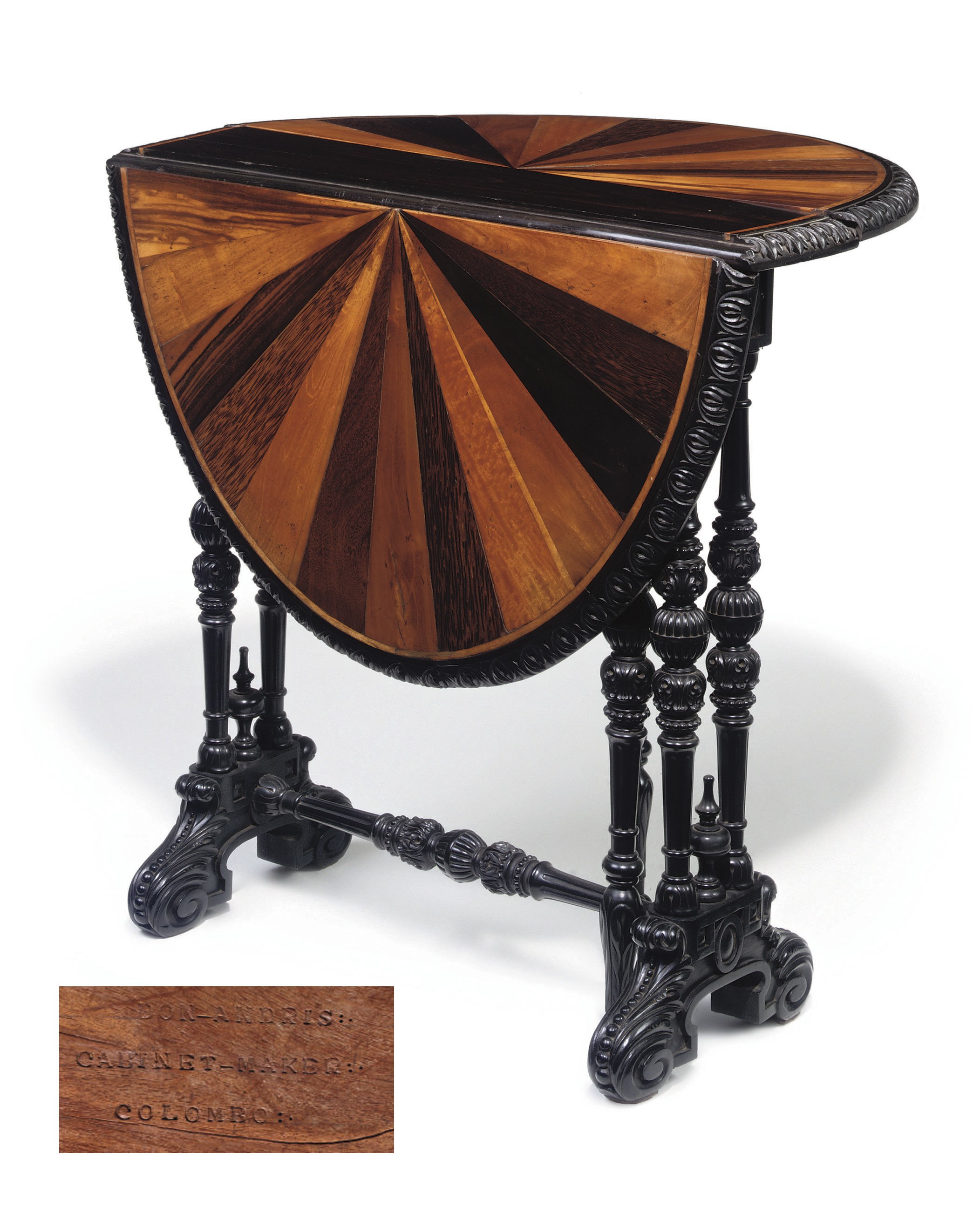AN ANGLO-CEYLONESE EBONY AND SPECIMEN WOOD SUTHERLAND TABLE